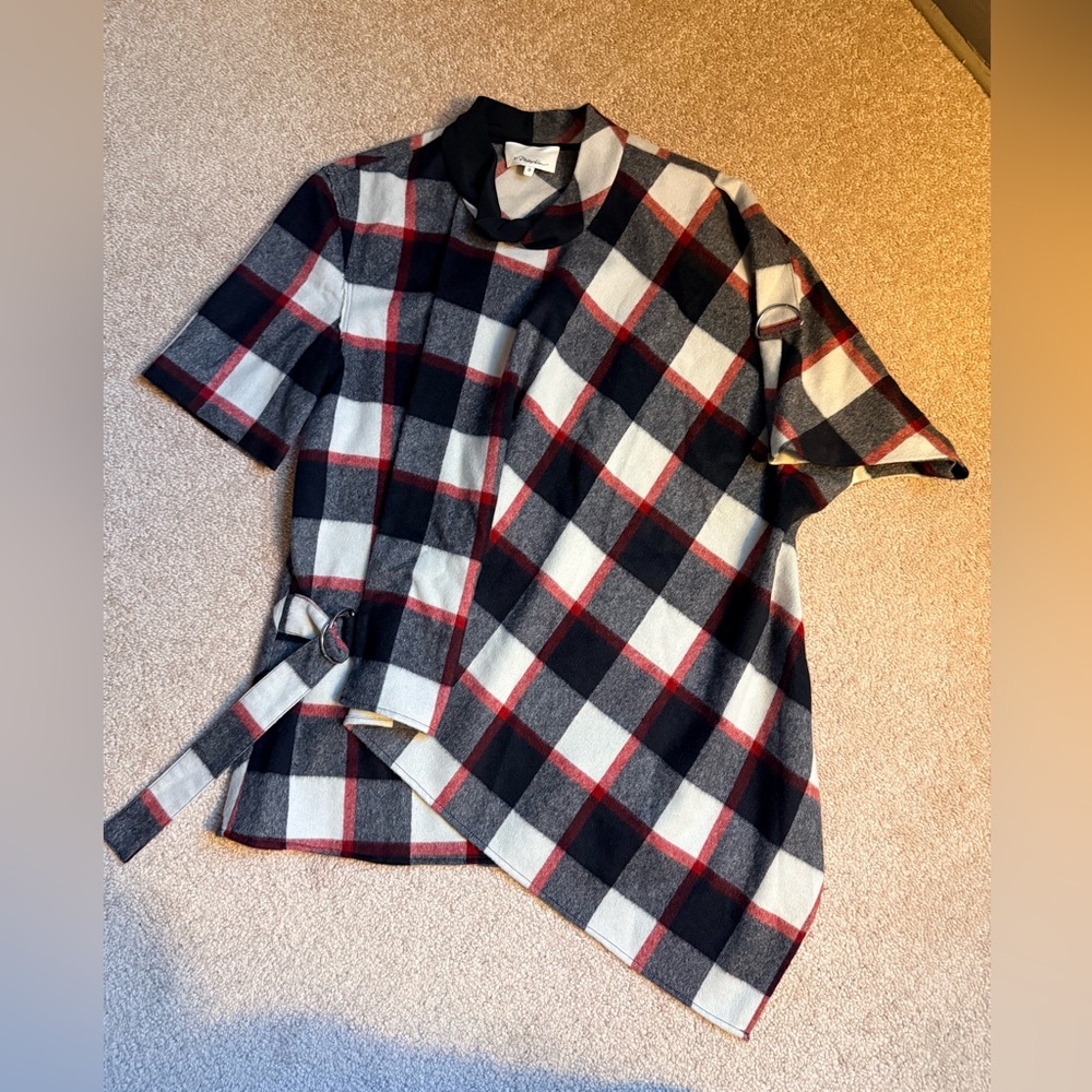 3.1 Phillip Lim Asymmetrical poncho-style plaid shirt with tie waist detail.
